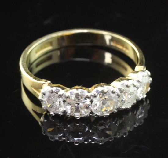 An early 1990s 18ct gold and five stone diamond half hoop ring, size P.